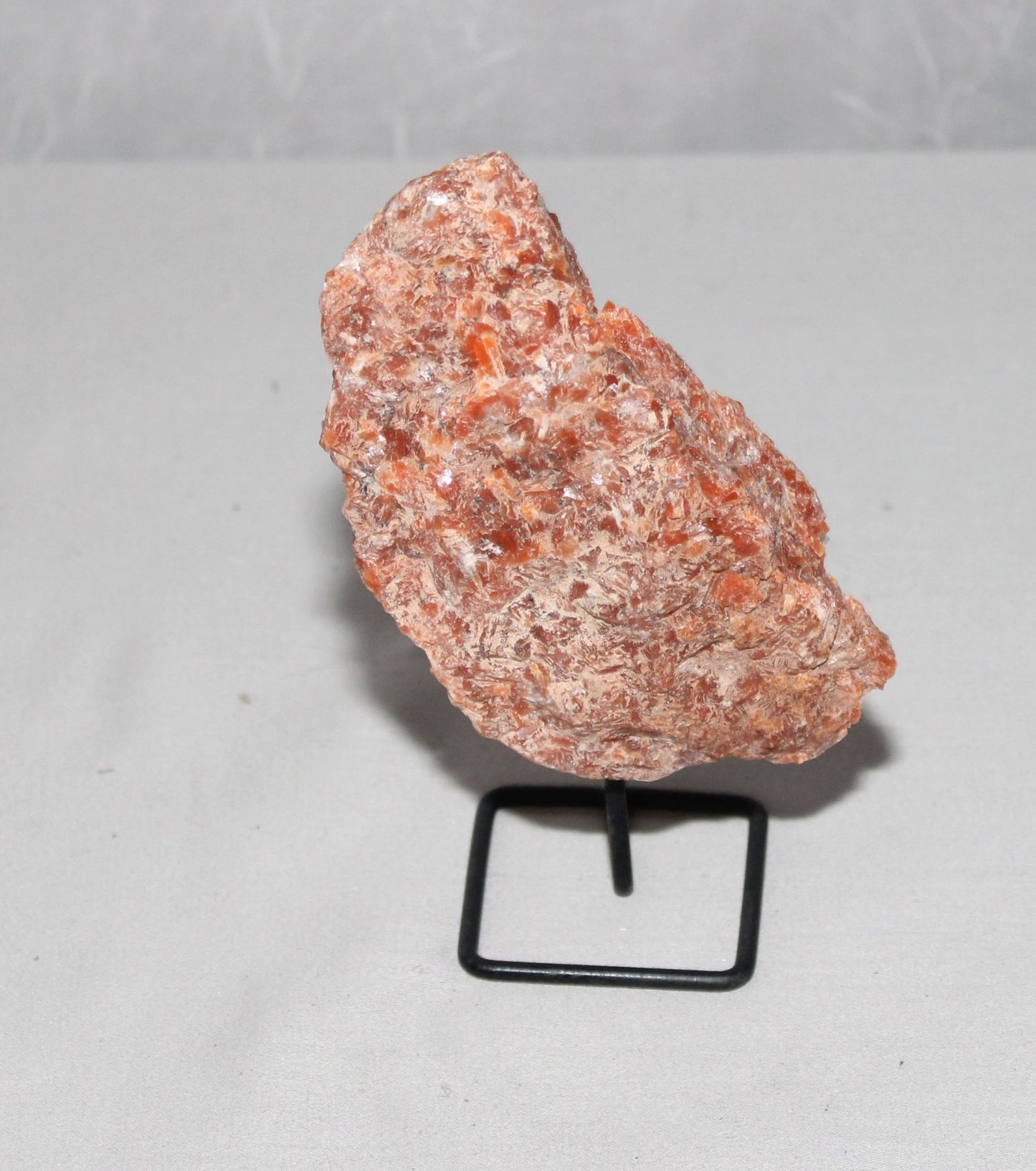 Orange Calcite Specimen on Stand