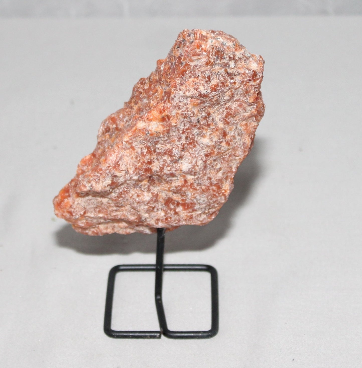 Orange Calcite Specimen on Stand